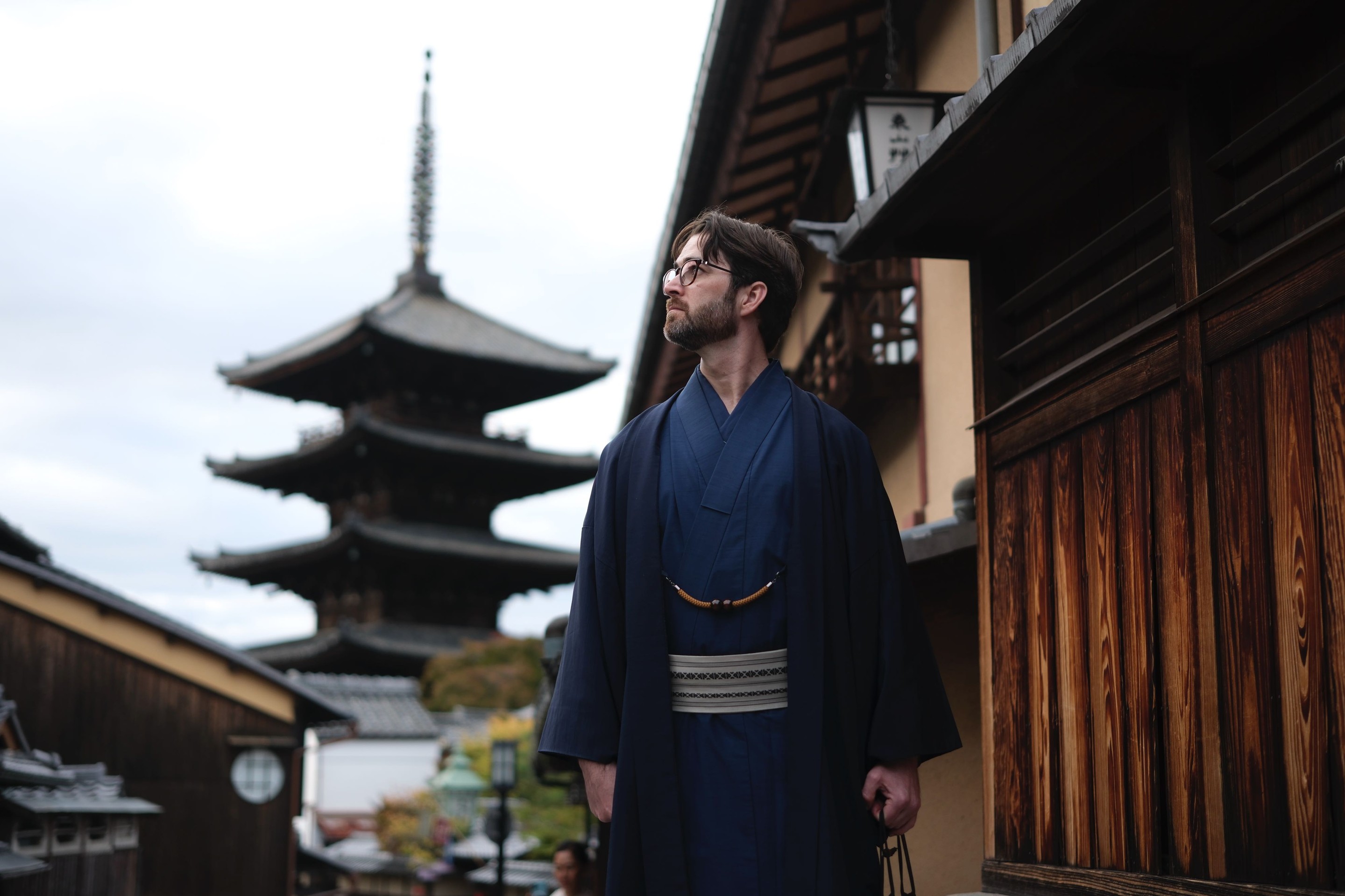 Aydrian in a blue kimono with Yasaka Pagoda in the background, Kyoto.